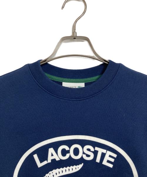 LACOSTE（ラコステ）LACOSTE (ラコステ) フロッキーオーバルクロッククルーネックスウェット　ダカワニフロッキースウェット　 ネイビー サイズ:US Sの古着・服飾アイテム