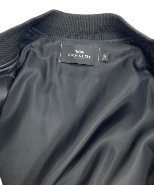 COACH（コーチ）COACH (コーチ) Leather Varsity Jacket  レザーバーシティジャケット レザージャケット　レザースタジャン　アウター　ライトアウター　羊革 ブラック サイズ:Mの古着・服飾アイテム