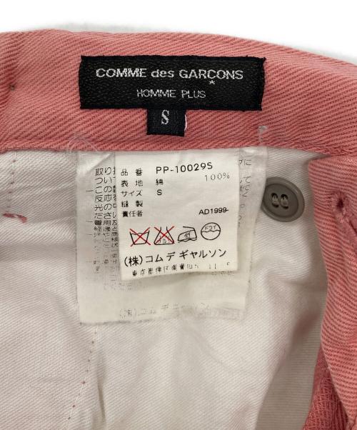 COMME des GARCONS HOMME PLUS（コムデギャルソンオムプリュス）COMME des GARCONS HOMME PLUS (コムデギャルソンオムプリュス) サイドボタンアーカイブカラーパンツ　コットンパンツ　日本製 ピンク サイズ:Sの古着・服飾アイテム