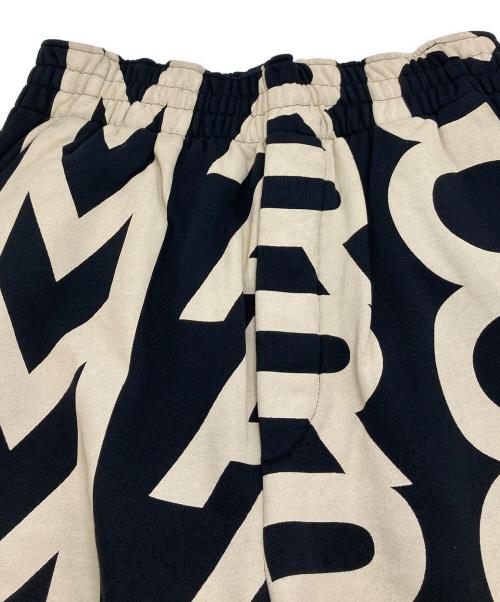 MARC JACOBS（マークジェイコブス）MARC JACOBS (マークジェイコブス) モノグラム ワイドパンツ　スウェットパンツ　総柄 ブラック×ベージュ サイズ:XSの古着・服飾アイテム