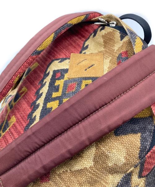 THE NORTHFACE PURPLELABEL（ザ・ノースフェイス パープルレーベル）THE NORTHFACE PURPLELABEL (ザ・ノースフェイス パープルレーベル) ネイティブ柄リュック　通勤 通学 仕事 出張 旅行 トラベル タウンユース レッド サイズ:実寸参照の古着・服飾アイテム