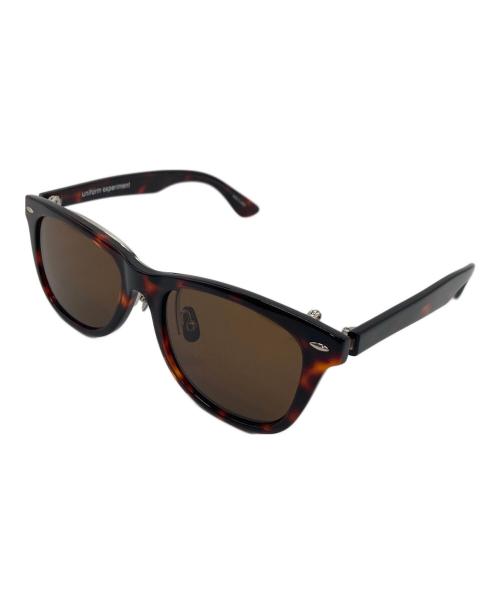 uniform experiment（ユニフォームエクスペリメント）uniform experiment (ユニフォームエクスペリメント) 金子眼鏡 (カネコガンキョウ) FLIP-UP WELLINGTON SUNGLASSES  フリップアップウェリントンサングラス ブラウン サイズ:FREEの古着・服飾アイテム