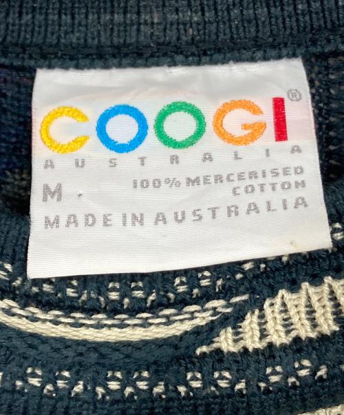 Coogi（クージー）Coogi (クージー) 【古着】3Ｄニット　総柄ニット　オーストラリア製 ベージュ×ネイビー サイズ:Mの古着・服飾アイテム