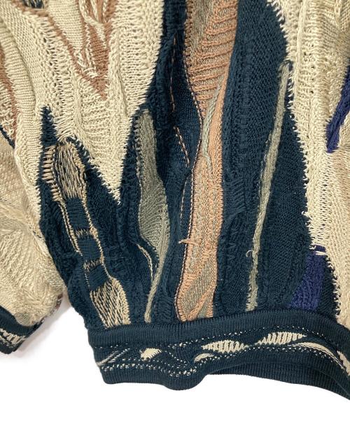 Coogi（クージー）Coogi (クージー) 【古着】3Ｄニット　総柄ニット　オーストラリア製 ベージュ×ネイビー サイズ:Mの古着・服飾アイテム