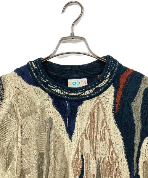 Coogi（クージー）Coogi (クージー) 【古着】3Ｄニット　総柄ニット　オーストラリア製 ベージュ×ネイビー サイズ:Mの古着・服飾アイテム