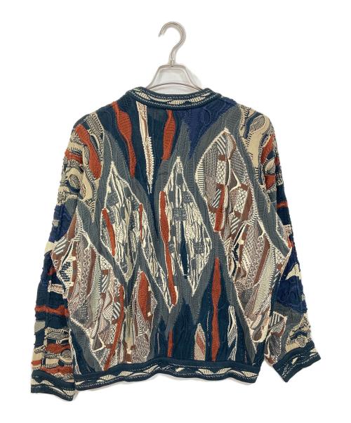 Coogi（クージー）Coogi (クージー) 【古着】3Ｄニット　総柄ニット　オーストラリア製 ベージュ×ネイビー サイズ:Mの古着・服飾アイテム