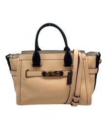 COACH（コーチ）の古着「ターンロック 2WAYバッグ」｜ベージュ