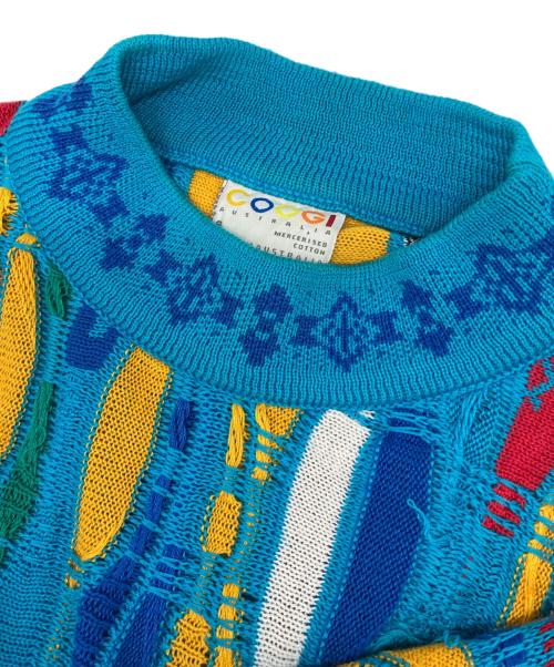 Coogi（クージー）Coogi (クージー) 3Dニット　青　黄色　白　緑　黒 ブルー サイズ:Sの古着・服飾アイテム