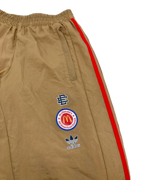 adidas（アディダス）adidas (アディダス) ERIC EMANUEL (エリック エマニュエル) マクドナルドコラボナイロントラックパンツ ベージュ サイズ:Mの古着・服飾アイテム