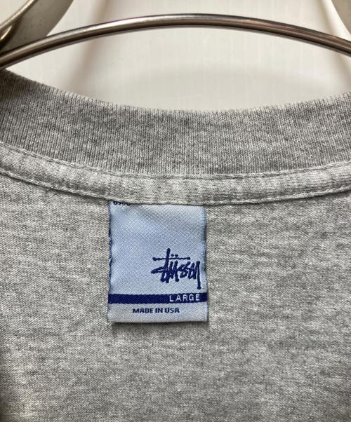 stussy（ステューシー）stussy (ステューシー) グラフィックプリントTシャツ グレー サイズ:Lの古着・服飾アイテム