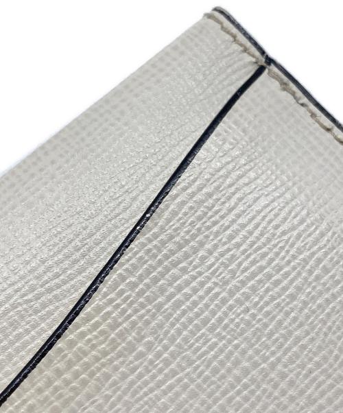 Valextra（ヴァレクストラ）Valextra (ヴァレクストラ) レザーフラップカードケース アイボリーの古着・服飾アイテム