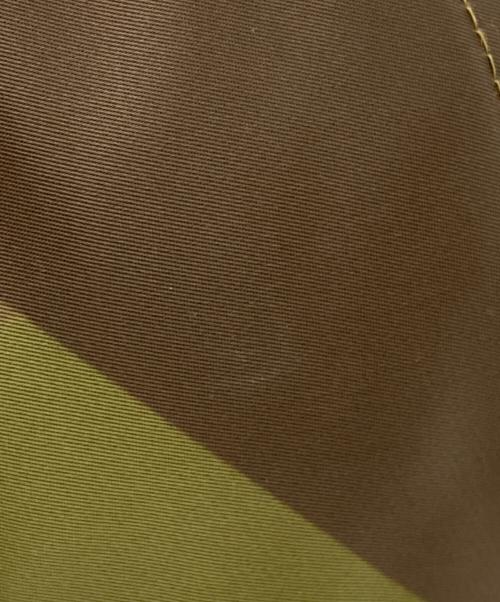 sacai（サカイ）sacai (サカイ) KAWS (カウズ) キャップ グリーンの古着・服飾アイテム