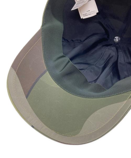 sacai（サカイ）sacai (サカイ) KAWS (カウズ) キャップ グリーンの古着・服飾アイテム