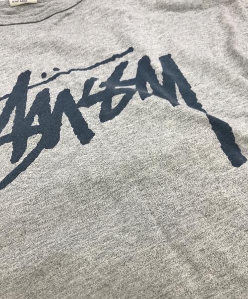 Champion（チャンピオン）Champion (チャンピオン) stussy (ステューシー) コラボTシャツ グレー サイズ:Mの古着・服飾アイテム
