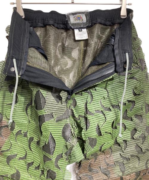 TIRED・TV（タイアード・ティーヴィー）TIRED・TV (タイアード・ティーヴィー) HIDE&SEEK CONVERTIBLE OVERPANT DESERT CAMO/ハイドアンドシーク・コンバーチブル・オーバーパンツ（デザートカモ柄） グリーン サイズ:Sの古着・服飾アイテム