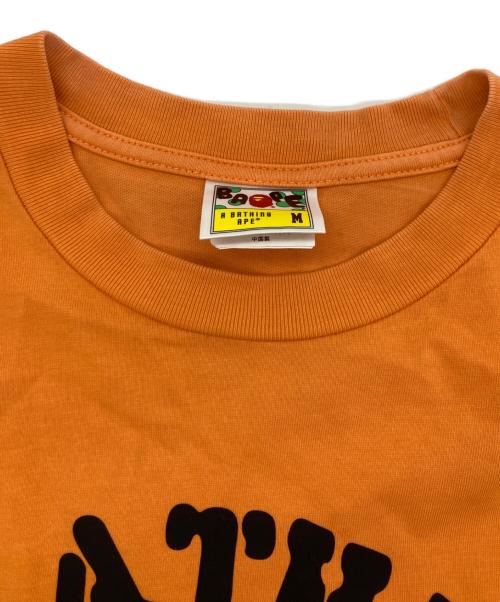BAPE BY A BATHING APE（ベイプバイアベイシングエイプ）BAPE BY A BATHING APE (ベイプバイアベイシングエイプ) OG APE HEAD COLLEGE RELAXED FIT TEE オレンジ サイズ:Ｍの古着・服飾アイテム