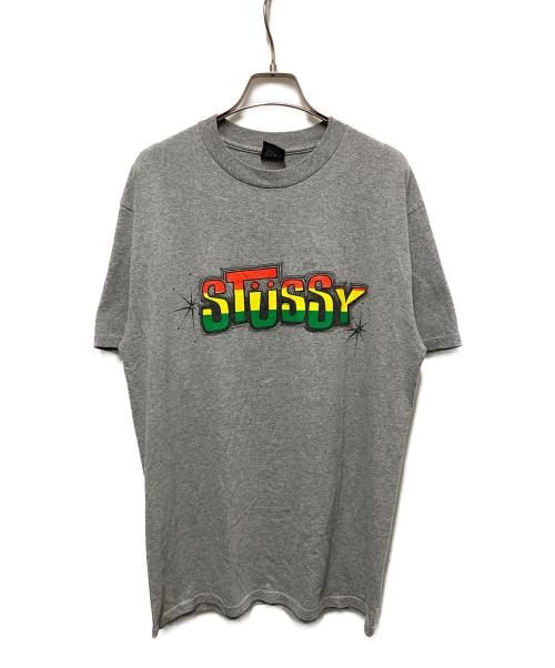 stussy（ステューシー）stussy (ステューシー) ラスタカラーTee グレー サイズ:	SIZE Mの古着・服飾アイテム