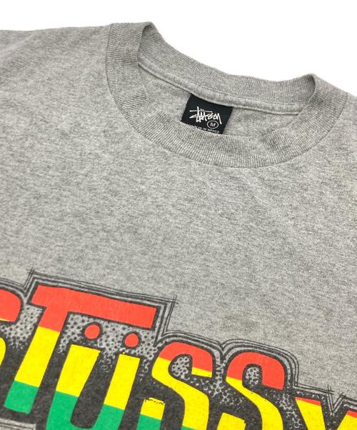 stussy（ステューシー）stussy (ステューシー) ラスタカラーTee グレー サイズ:	SIZE Mの古着・服飾アイテム