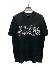 stussy（ステューシー）の古着「フラワーグラフィックTEE」｜ブラック