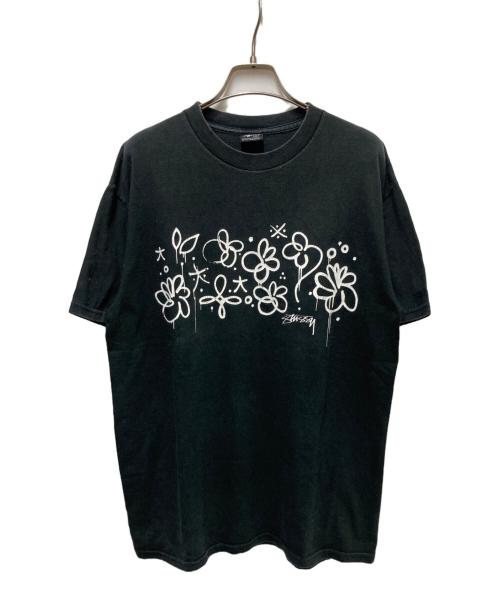 stussy（ステューシー）stussy (ステューシー) フラワーグラフィックTEE ブラック サイズ:Mの古着・服飾アイテム