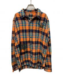 stussy（ステューシー）の古着「00sグラフィックプリントチェックシャツ」｜オレンジ