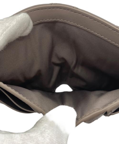 TORY BURCH（トリーバーチ）TORY BURCH (トリーバーチ) 2つ折り財布 グレーの古着・服飾アイテム