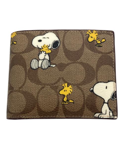 COACH（コーチ）COACH (コーチ) PEANUTS (ピーナッツ) ウォレット・シグネチャー・スヌーピー ウッドストック ベージュの古着・服飾アイテム