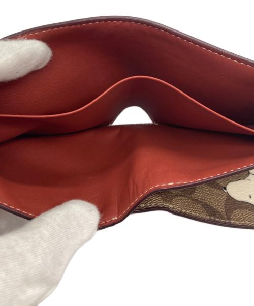 COACH（コーチ）COACH (コーチ) PEANUTS (ピーナッツ) ウォレット・シグネチャー・スヌーピー ウッドストック ベージュの古着・服飾アイテム