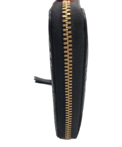 COMME des GARCONS（コムデギャルソン）COMME des GARCONS (コムデギャルソン) ラウンド型ジップウォレット ブラックの古着・服飾アイテム