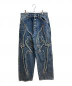 THUG CLUBサグ クラブ）の古着「トライバルデニムパンツ」｜インディゴ