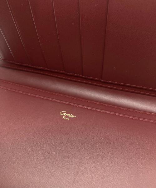 Cartier（カルティエ）Cartier (カルティエ) 二つ折り長財布 レッドの古着・服飾アイテム