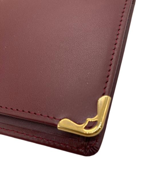 Cartier（カルティエ）Cartier (カルティエ) 二つ折り長財布 レッドの古着・服飾アイテム