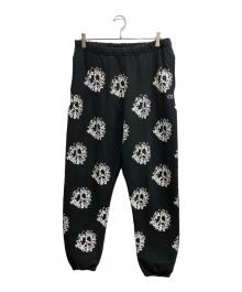 Denim Tears（デニムティアーズ）の古着「総柄 裏起毛スウェットパンツ」｜ブラック