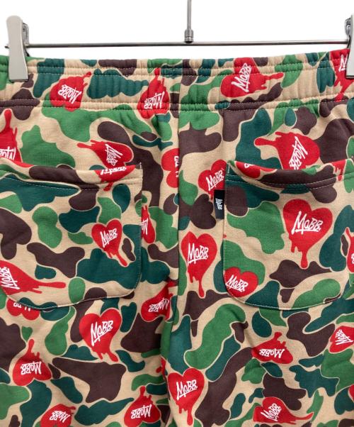 MOBB（モブ）MOBB (モブ) HEART DRIP CAMO PANTS/MoBBパンツ カーキ サイズ:L 未使用品の古着・服飾アイテム