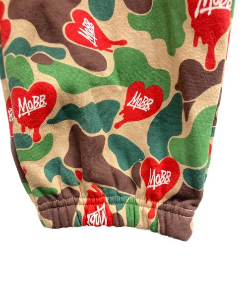 MOBB（モブ）MOBB (モブ) HEART DRIP CAMO PANTS/MoBBパンツ カーキ サイズ:L 未使用品の古着・服飾アイテム