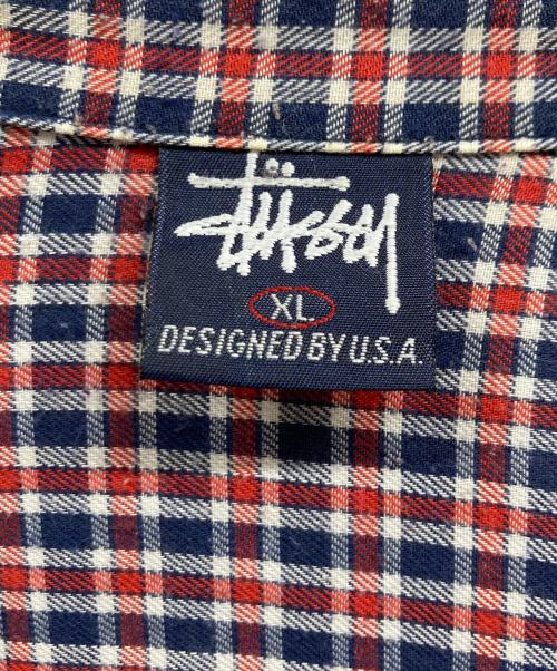 stussy（ステューシー）stussy (ステューシー) 紺タグ チェックシャツ レッド×ネイビー サイズ:XLの古着・服飾アイテム