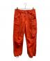 AVIREX（アヴィレックス）の古着「M-65 FATIGUE PANTS」｜オレンジ