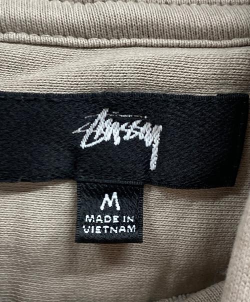 stussy（ステューシー）stussy (ステューシー) プルオーバーパーカー ベージュ サイズ:Mの古着・服飾アイテム