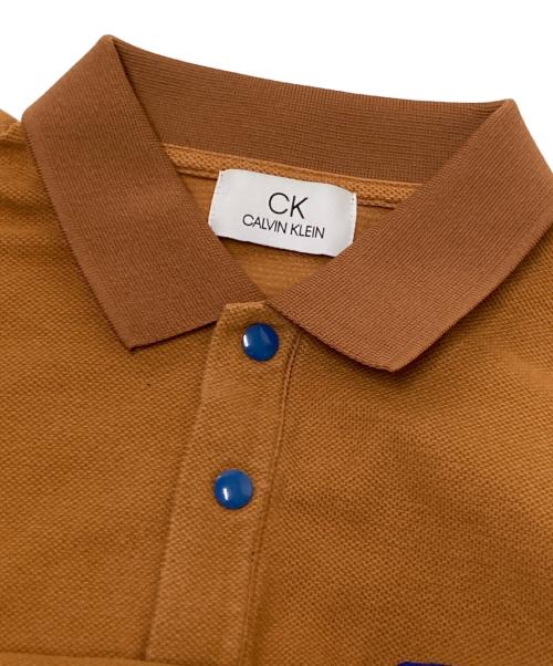 Calvin Klein（カルバンクライン）Calvin Klein (カルバンクライン) ポロシャツ ブラウン サイズ:XLの古着・服飾アイテム