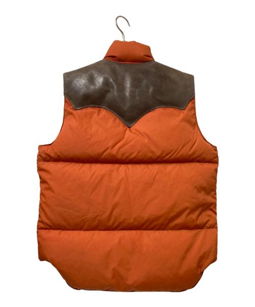 Rocky Mountain FeatherBed（ロッキーマウンテンフェザーベッド）Rocky Mountain FeatherBed (ロッキーマウンテンフェザーベッド) WAREHOUSE (ウエアハウス) ダウンベスト オレンジ×ブラウン サイズ:Mの古着・服飾アイテム