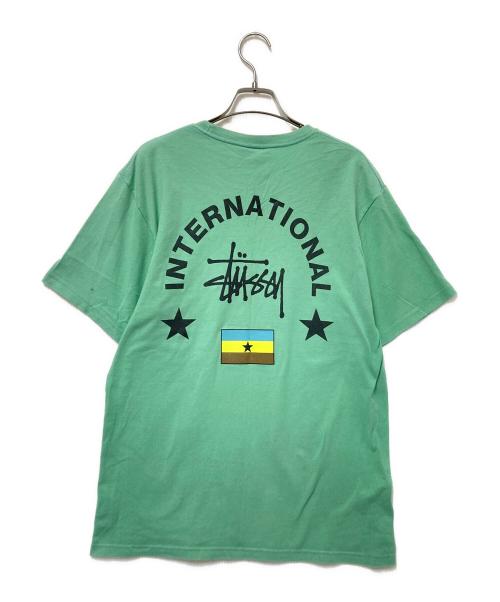 stussy（ステューシー）stussy (ステューシー) インターナショナルプリントTシャツ グリーン サイズ:Mの古着・服飾アイテム