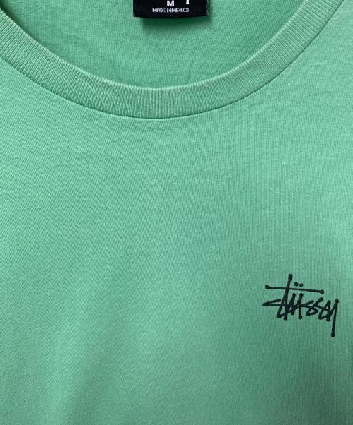 stussy（ステューシー）stussy (ステューシー) インターナショナルプリントTシャツ グリーン サイズ:Mの古着・服飾アイテム