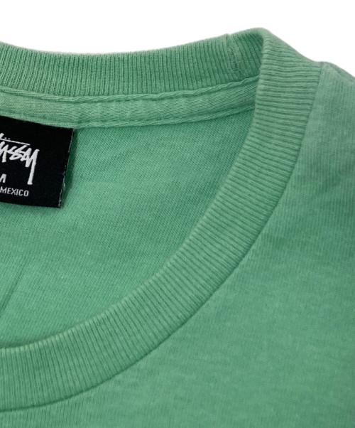 stussy（ステューシー）stussy (ステューシー) インターナショナルプリントTシャツ グリーン サイズ:Mの古着・服飾アイテム