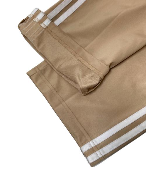 adidas（アディダス）adidas (アディダス) アディカラー クラシックス ファイヤーバード トラックパンツ ベージュ サイズ:Sの古着・服飾アイテム