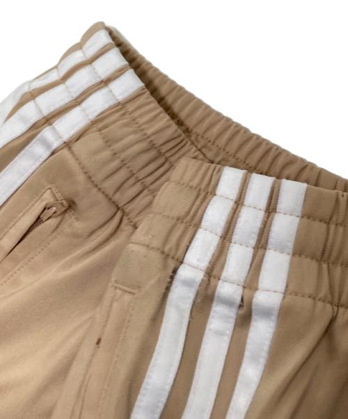 adidas（アディダス）adidas (アディダス) アディカラー クラシックス ファイヤーバード トラックパンツ ベージュ サイズ:Sの古着・服飾アイテム