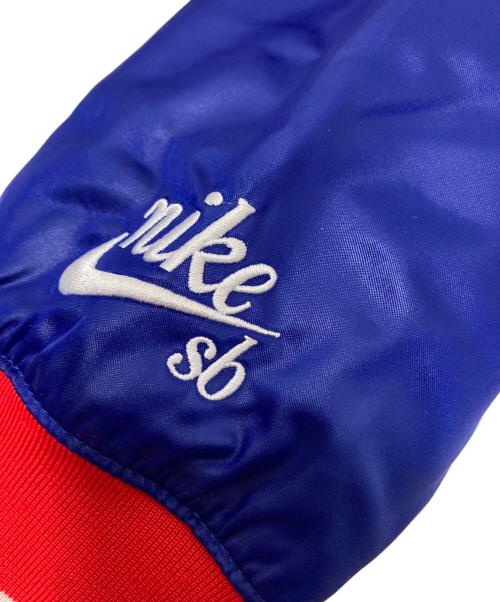 NIKE SB（ナイキエスビー）NIKE SB (ナイキエスビー) NBA (エヌビーエー) スタジャン ブルー×レッド サイズ:Lの古着・服飾アイテム