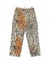 stussy（ステューシー）の古着「STENCIL CANVAS BIG OL JEANS」｜オレンジ×ベージュ