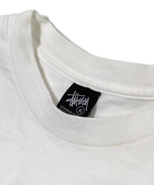 stussy（ステューシー）stussy (ステューシー) ワールドツアーグラフィックプリントTシャツ ホワイト×ブラック サイズ:XLの古着・服飾アイテム