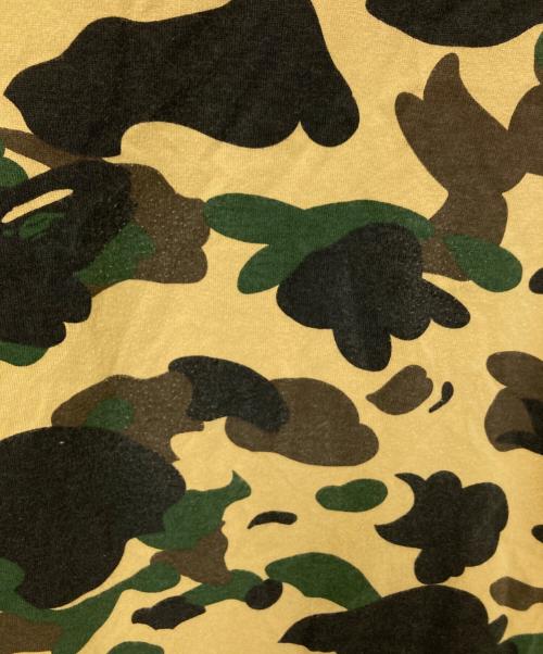 A BATHING APE（アベイシングエイプ）A BATHING APE (アベイシングエイプ) stussy (ステューシー) 30周年記念 1stカモ 猿迷彩 ワールドツアー Tシャツ ベージュ×グリーン サイズ:Mの古着・服飾アイテム