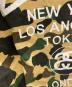 中古・古着 A BATHING APE (アベイシングエイプ) stussy (ステューシー) 30周年記念 1stカモ 猿迷彩 ワールドツアー Tシャツ ベージュ×グリーン サイズ:M：12000円